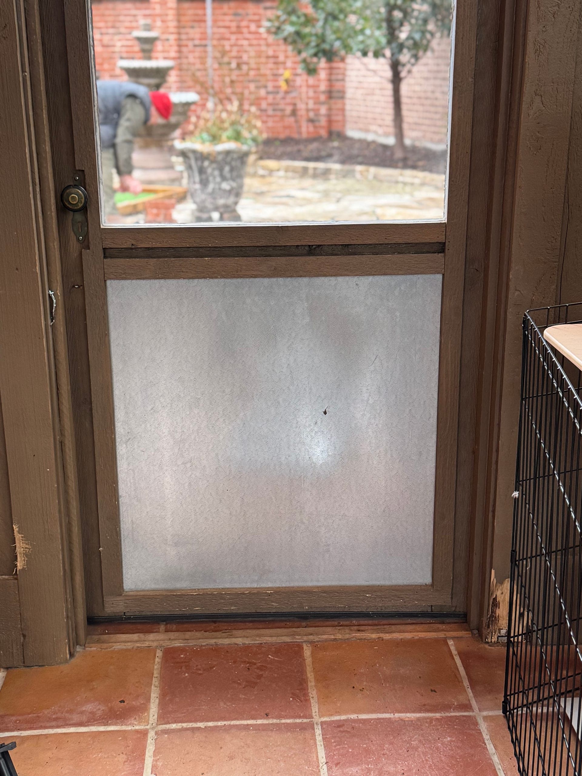 Pet door installation in progress by Chilton Home Services